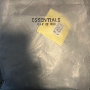 Fear of God Essentials Translucent Packaging with Black Lettering